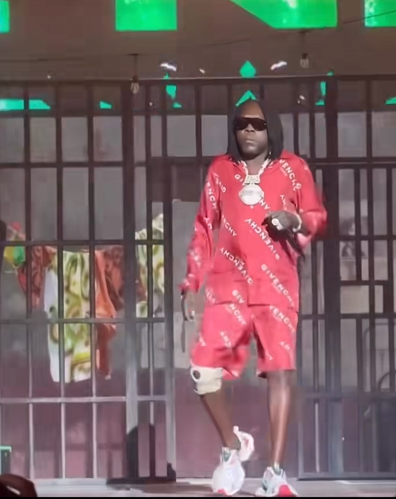 Kartel stepping out of prison cell on stage